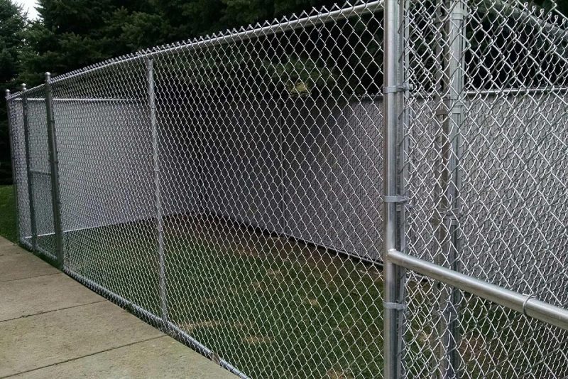 How can I maintain my chain-link fence in Chicago
