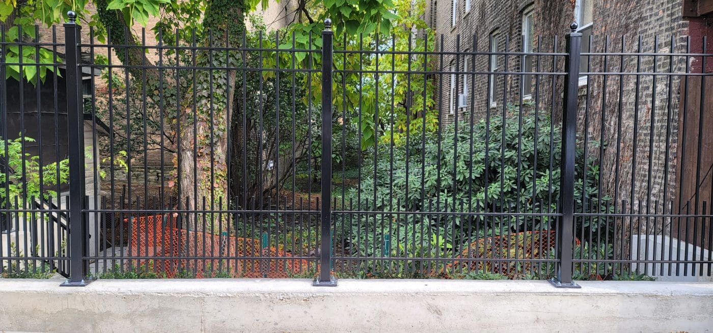 Custom iron fence installation for residential property in Chicago