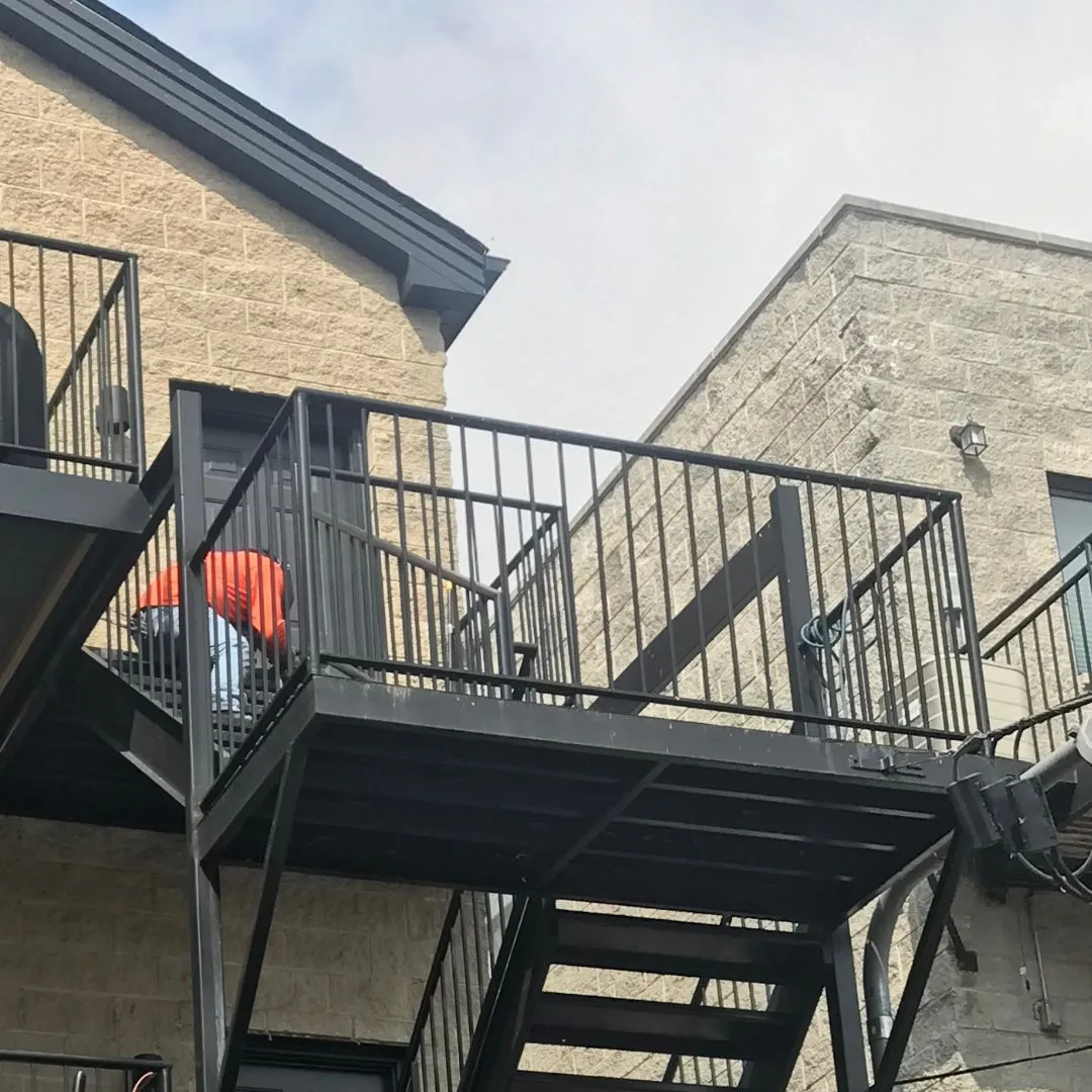 Custom iron balcony and stair railing installation in Chicago